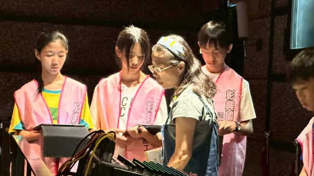 The troupe leader showed us the sound control equipment used in official performances.